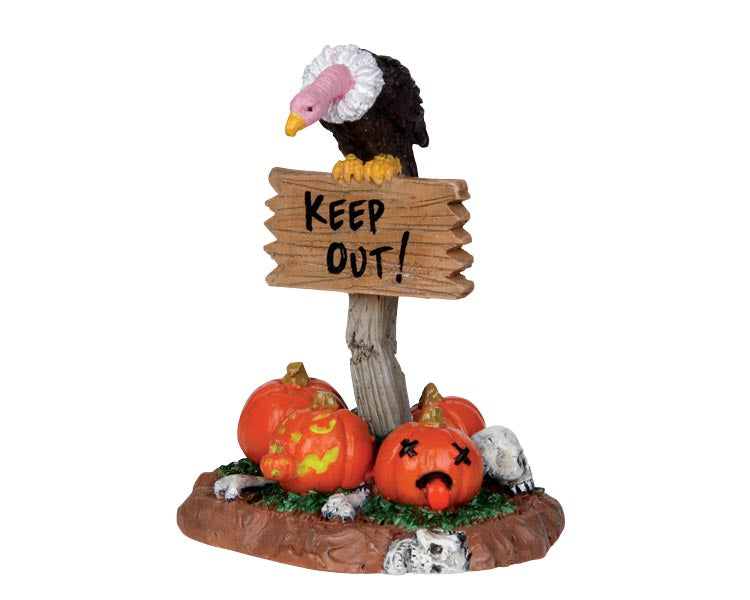 Lemax Spooky Town Keep Out! #24475 at Eerie Emporium - A vulture sits on top of sign that reads "KEEP OUT!" with jack o lanterns and bones at the base.