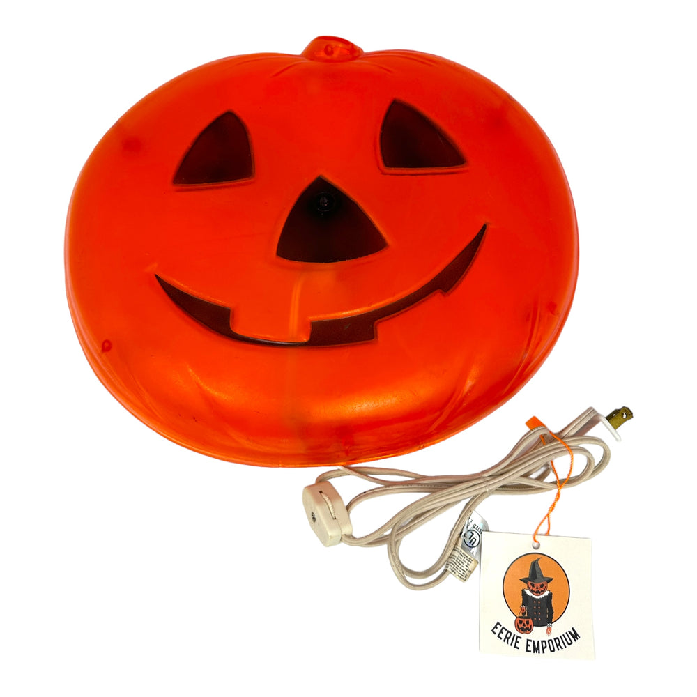 Vintage Halloween Hard Plastic Lighted Pumpkin Wall Decoration at Eerie Emporium.