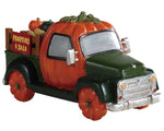 Lemax Spooky Town Pumpkin Truck #93445 at Eerie Emporium - A truck with a cab and wheels shaped like pumpkins has a sign that reads "PUMPKINS 4 SALE".