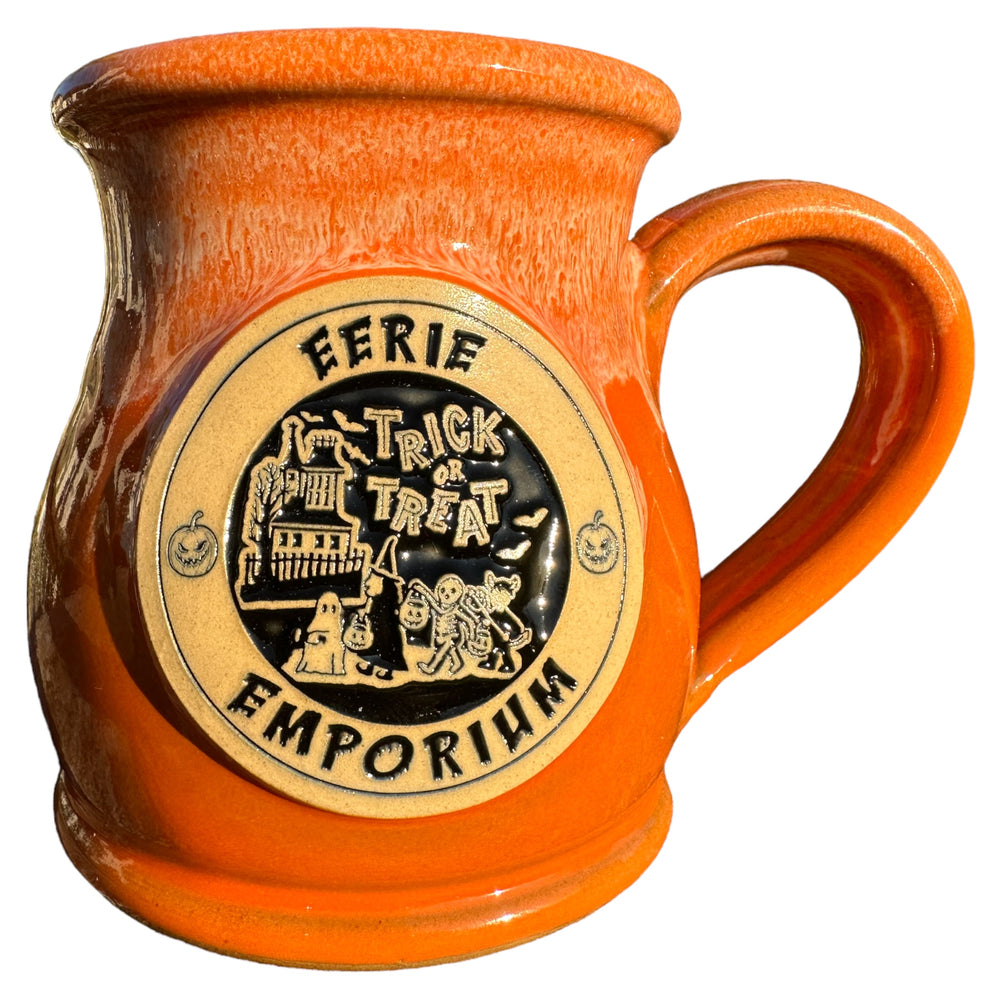 
            
                Load image into Gallery viewer, Eerie Emporium Trick or Treat Coffee Mug in Pumpkin Patch Parade Color Scheme.
            
        