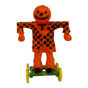 Vintage Halloween Rosbro Plastic Checkered Scarecrow JOL On Wheels ~ Candy Container Toy 1950s at Eerie Emporium. 2