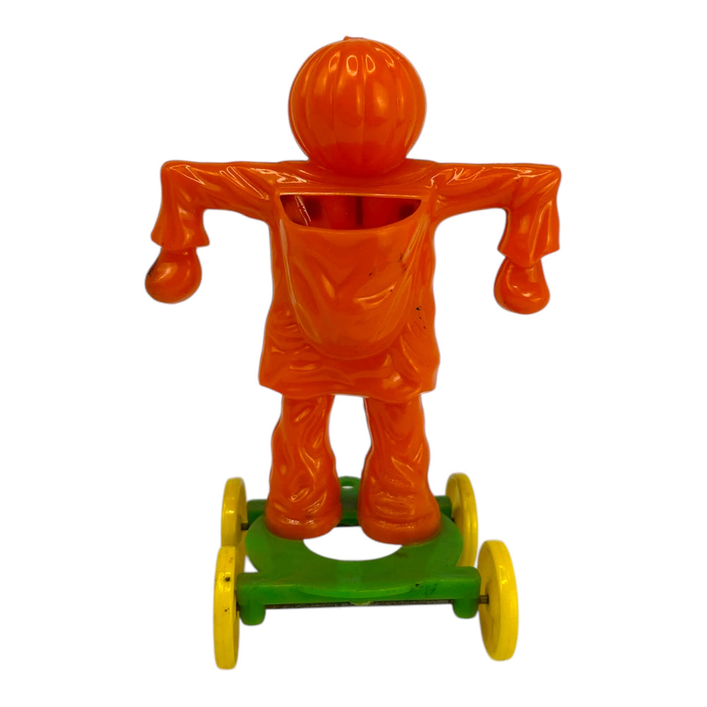 Vintage Halloween Rosbro Plastic Checkered Scarecrow JOL On Wheels ~ Candy Container Toy 1950s at Eerie Emporium. 3