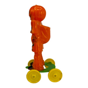 Vintage Halloween Rosbro Plastic Checkered Scarecrow JOL On Wheels ~ Candy Container Toy 1950s at Eerie Emporium. 5