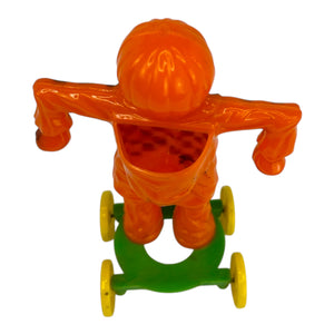 Vintage Halloween Rosbro Plastic Checkered Scarecrow JOL On Wheels ~ Candy Container Toy 1950s at Eerie Emporium. 6
