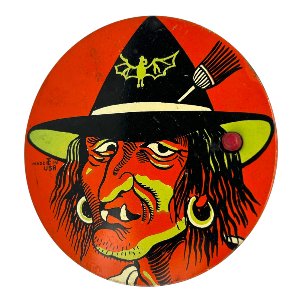 Vintage Halloween T. Cohn Tin Ratchet Noisemaker Scary Witch with Fangs + Green Coloring at Eerie Emporium. 2