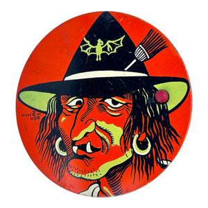 Vintage Halloween T. Cohn Tin Ratchet Noisemaker Scary Witch with Fangs + Green Coloring at Eerie Emporium. 