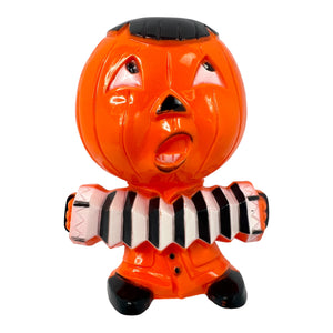 Vintage Halloween Hard Plastic Rosbro Jack-O'-Lantern Playing Accordion Candy Container from the 1950s at Eerie Emporium.