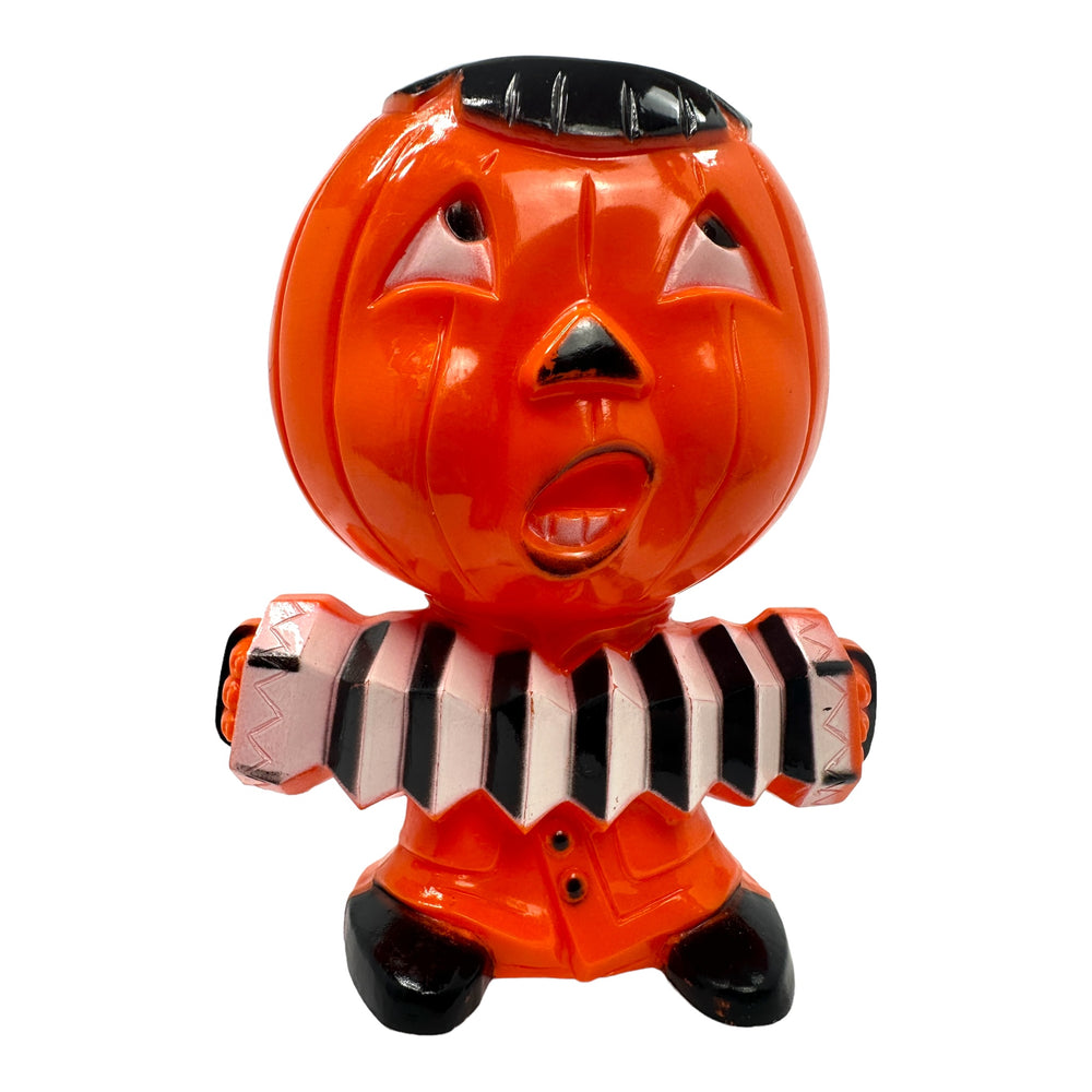 Vintage Halloween Hard Plastic Rosbro Jack-O'-Lantern Playing Accordion Candy Container from the 1950s at Eerie Emporium.