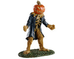 A sinister monster with a grinning jack-o'-lantern for a face and a long blue trench coat plots his next evil act.