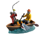 On a tiny raft, two skeletons are dressed in full fishing gear. One of them is paddling while the other tries to reel in a huge shark. Usually, it's the fishermen that would be afraid of the shark, but this time, the shark needs to be afraid of these skeletal fishermen.