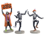 Three groovy skeletons dance together. One is wearing an orange jacket and holding a boom box above his head.