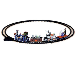 Multiple monsters engage in various activities on a spooky train that moves around a circular black track.