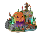 A large Island is made of one giant jack o' lantnern and there's steam/fog coming from the pumpkins mouth. Additionally, there are tons of smaller jack o' lanterns all over the island. 