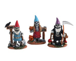 A three-piece set includes a gnome with a red hat, a big white beard, and a sign that says "Get Out!" The second gnome is wearing a blue hat with long braids while holding a pumpkin and a sign that says "Pick at Your Own Risk!" The third gnome has a long white beard and he's wearing a purple hat while holding a scythe.