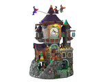 A massive Stone clock tower with a purple roof is covered in witches including 3 flying above the structure. Green lights and bubbling cauldrons add spooky elements to the piece.
