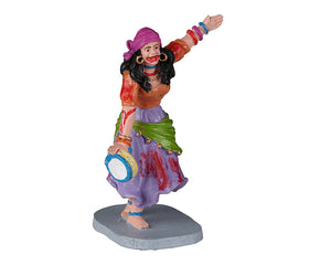 A gypsy woman dances in colorful clothes while covered in blood.