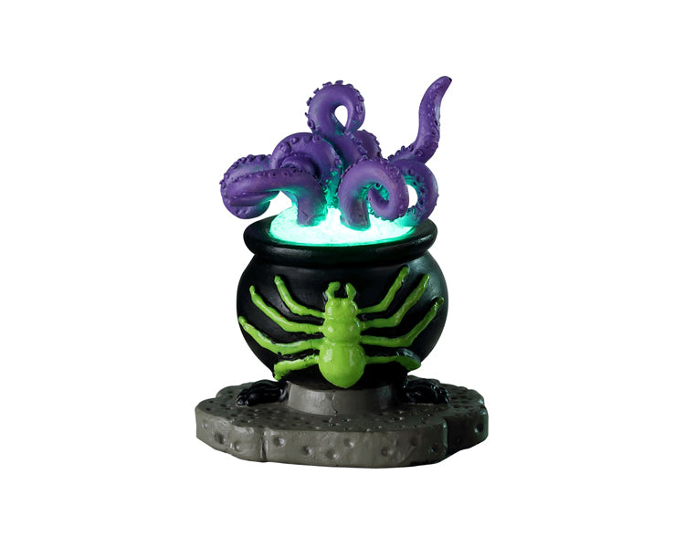 A cauldron with a bright green spider on it is filled by bright blue water and purple monster tentacles. 