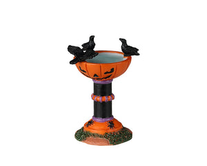 
            
                Load image into Gallery viewer, A pumpkin birdbath has three crows on it.
            
        