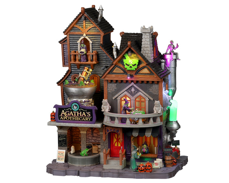 
            
                Load image into Gallery viewer, A large grey and purple building called Agatha&amp;#39;s Apothecary in covered in witches and skeletons.  There&amp;#39;s a bright red door as well as frogs and jack o&amp;#39; lanterns around.
            
        