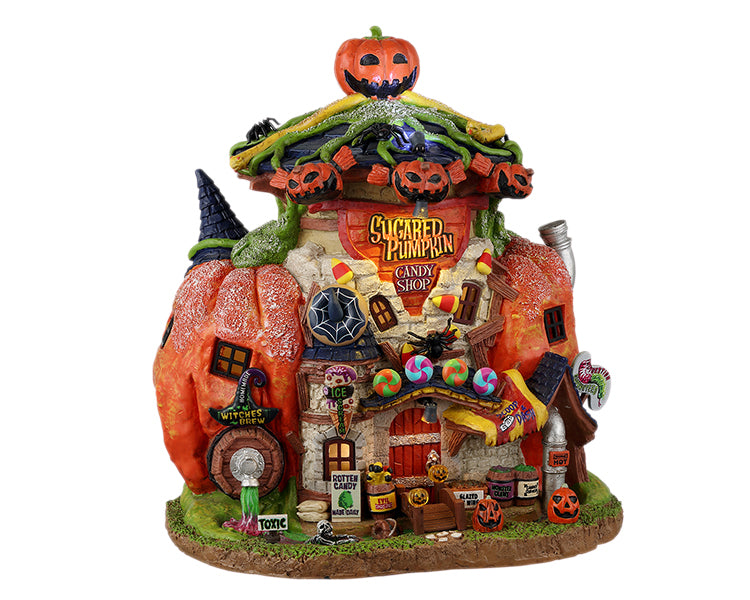 A whimsical pumpkin structure called the Sugared Pumpkin Candy Shop is covered in candy and jack o' lanterns.