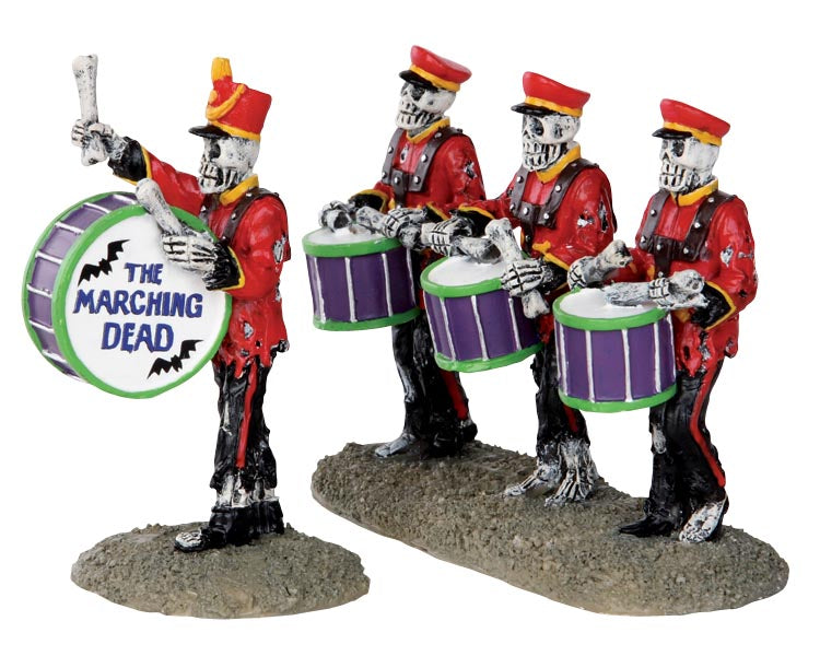
            
                Load image into Gallery viewer, Four skeletons dressed in red jackets and red and black pants march and drum on their purple and green drums using bones. One Skeleton is the leader out in front with a drum that reads The Marching Dead.
            
        