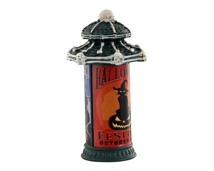 
            
                Load image into Gallery viewer, Lemax Spooky Town Creepy Bulletin #34074 - a green stone post has a sign on it that depicts a black cat wearing a witch hat sitting on a jack o lantern, the sign reads Halloween Festival October 31st.
            
        