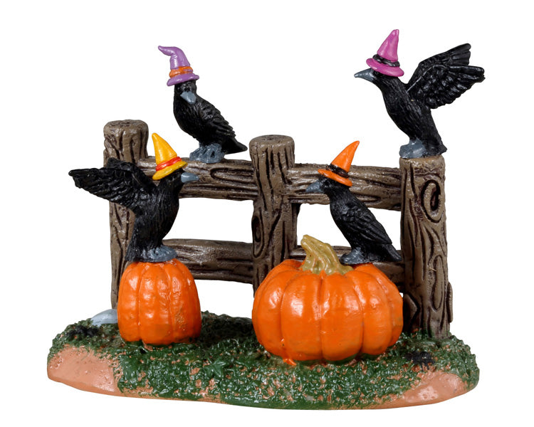 Lemax Spooky Town Halloween Crows #34077 - four creepy crows hangout on a fence and pumpkins while wearing purple and orange mini witch hats.