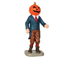 A well dressed humanoid figure with a pumpkin for a head.