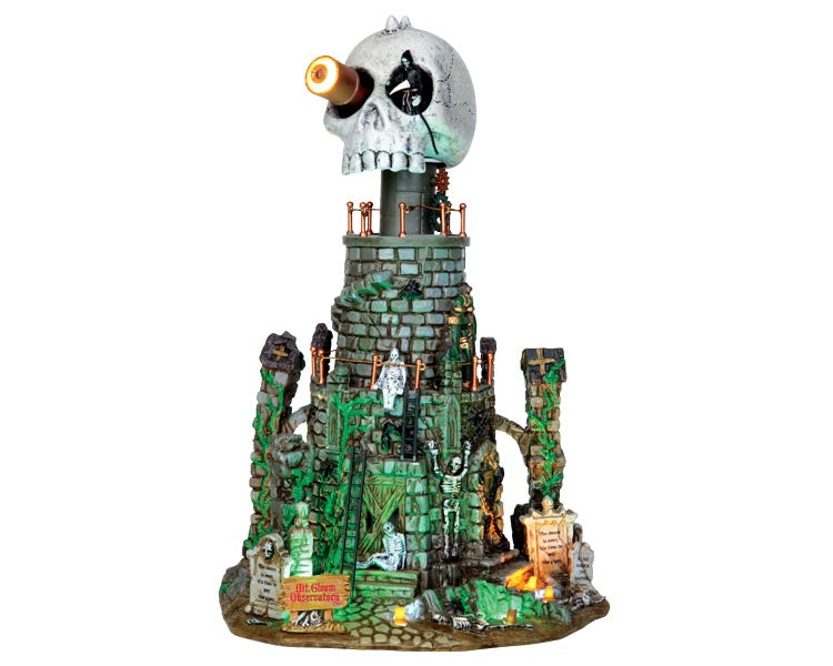 A large stone tower covered in poisonous vines is crawling in skeletons. The top of the tower which is a large skull rotates while a grim reaper looks in the distance for it's next victim.