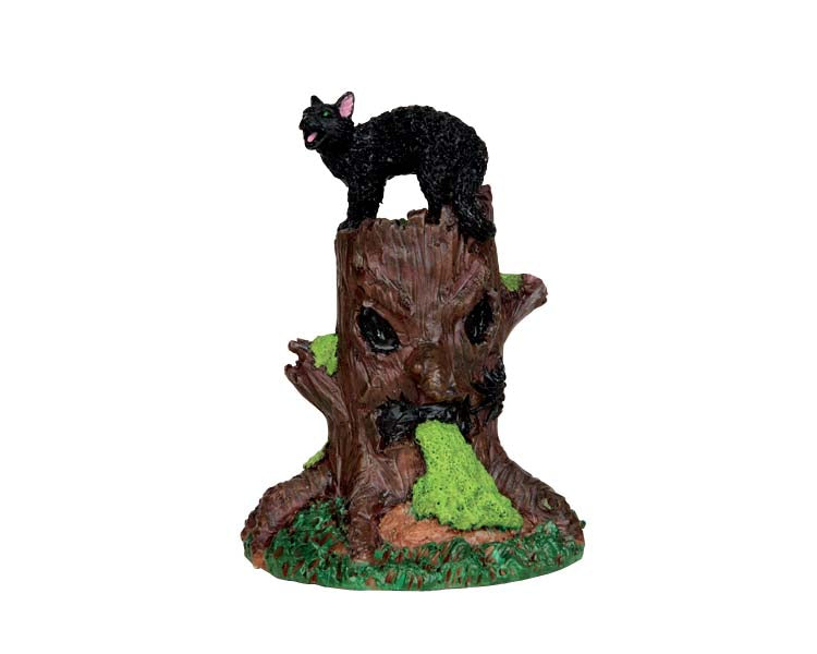 A black cat hisses on top of an evil tree stump that is oozing green slime. 