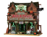 A large building has Banshee's Boo-B-Traps & Haunted Home Security is written across the front.  Cages drop down over a werewolf and vampire while pumpkins, cages and skulls warn visitors not to enter!