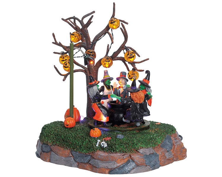 
            
                Load image into Gallery viewer, A group of witches dance around a ghoul (a man in a suit and top hat) as they boil him alive in their cauldron, underneath a pumpkin tree.
            
        