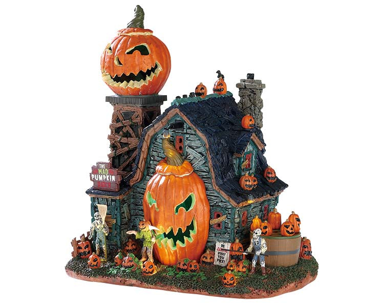A large farm barn is covered in jack-o'-lanterns including a large spinning one on the top of a tower and a massive sinister one that takes up 50% of the front of the barn. A scythe wielding scarecrow and two skeletons stand guard out front.
