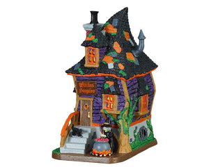 A crooked purple home with a sign over the front door that reads Witches Bungalow, has a witch stirring her bubbling cauldron and black cat sidekick out front. 