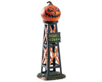 A black and orange wood water tower with a sign that reads Spooky Town is topped by a large sinister Jack-o'-lantern