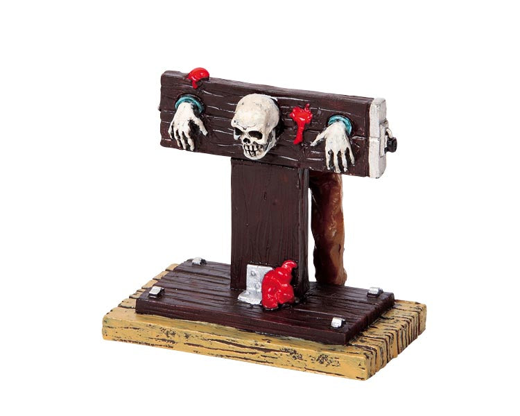 A skeleton is stuck in blood covered stocks.