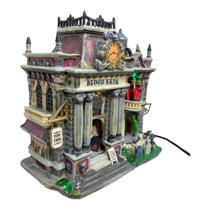 
            
                Load image into Gallery viewer, Retired Lemax Spooky Town The Blood Bank #55239 - A stone building is crawling in monsters including ghouls and vampires. A sign above the door reads Blood Bank.
            
        