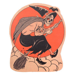 A wicked skeleton witch rides a broom in front of an orange moon with a bat flying overhead.