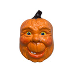 Vintage ceramic pumpkin face.