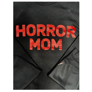 A black crewneck that has HORROR MOM across the chest in red and an embroidered knife on the sleeve