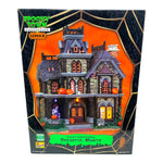 Retired Lemax Spooky Town Dreadful Manor #85708  - A dilapidated creepy mansions is covered in jack o lanterns, tombstones and skeletons.