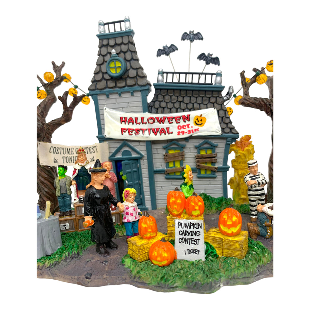 
            
                Load image into Gallery viewer, Retired Lemax Spooky Town Halloween Festival #43422 - A bunch of trick or treaters have a costume contest, bob for apples and celebrate Halloween surrounded by jack o&amp;#39; lanterns and other decorations. 
            
        