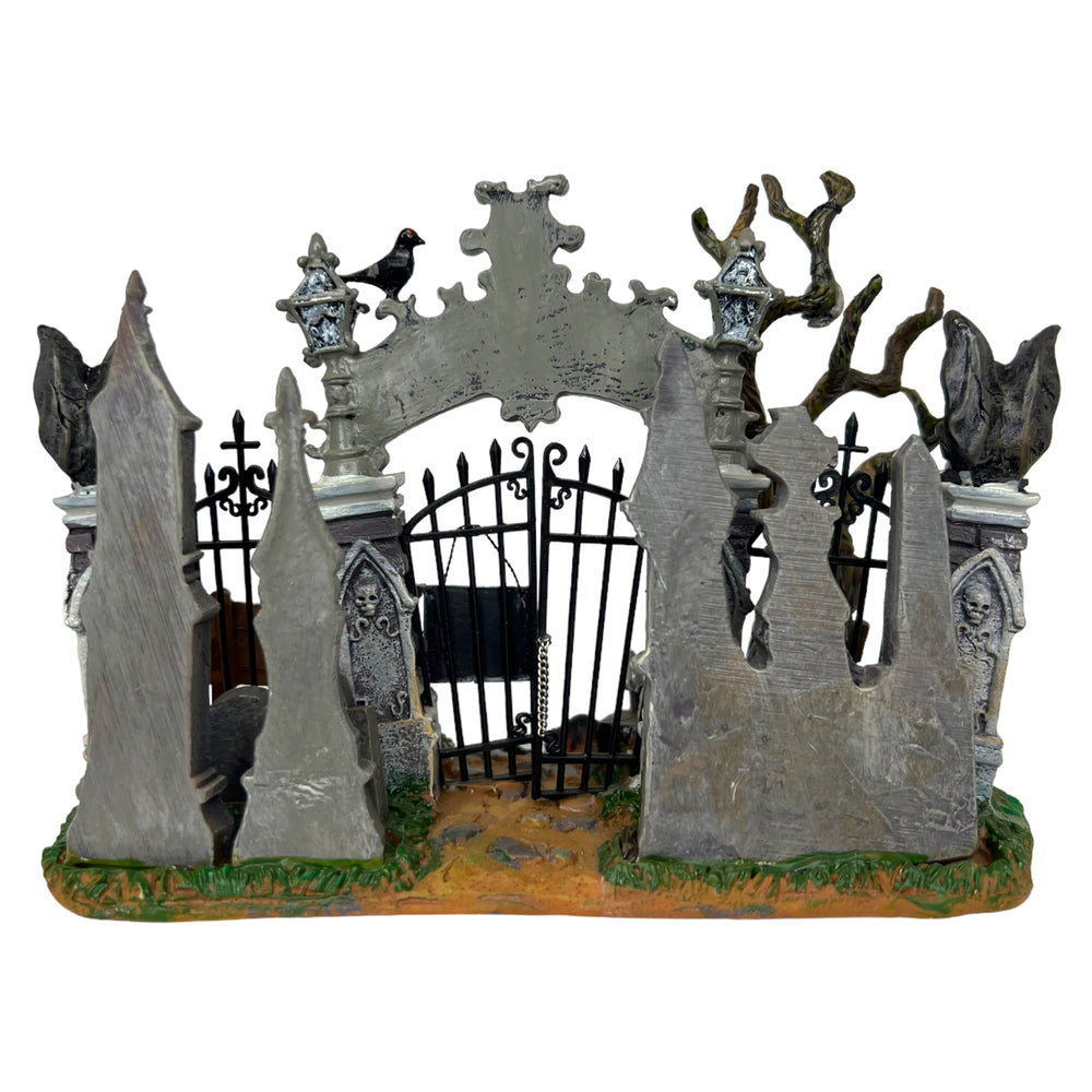 
            
                Load image into Gallery viewer, Retired Lemax Spooky Town Cemetery Gate #43421. A graveyard gate with the words forsaken cemetery written on the front.
            
        