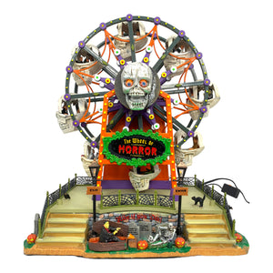 Retired Lemax Spooky Town The Wheel Of Horror #04162 - A creepy Ferris Wheel is covered in skulls, tombstones and monsters while costumed riders sit inside skull shaped seats.