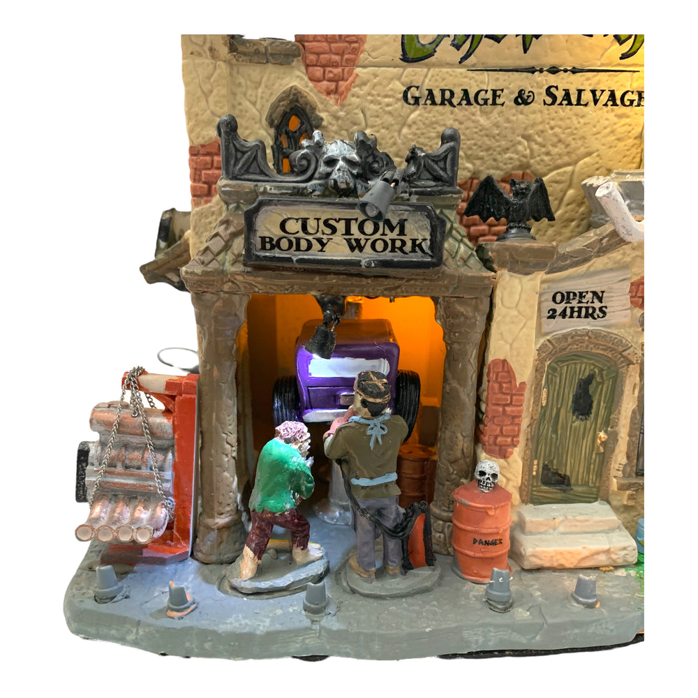 
            
                Load image into Gallery viewer, Lemax Spooky Town The Chop Shop Garage &amp;amp; Salvage Co. #25323
            
        